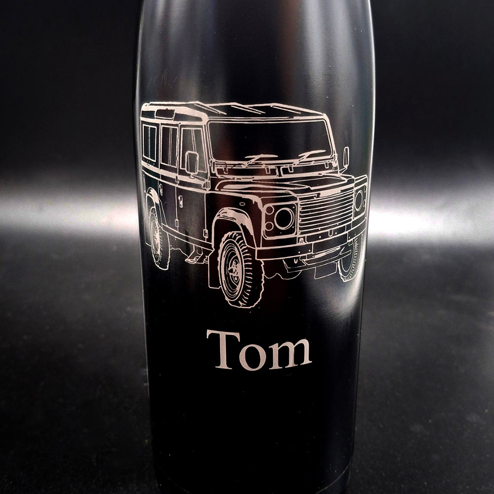 Close up of our Land rover artwork engraved on a black thermal bottle