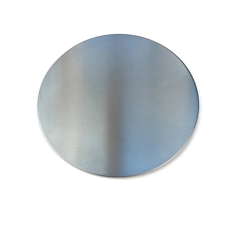 round brushed steel drinks coaster shown on a white background