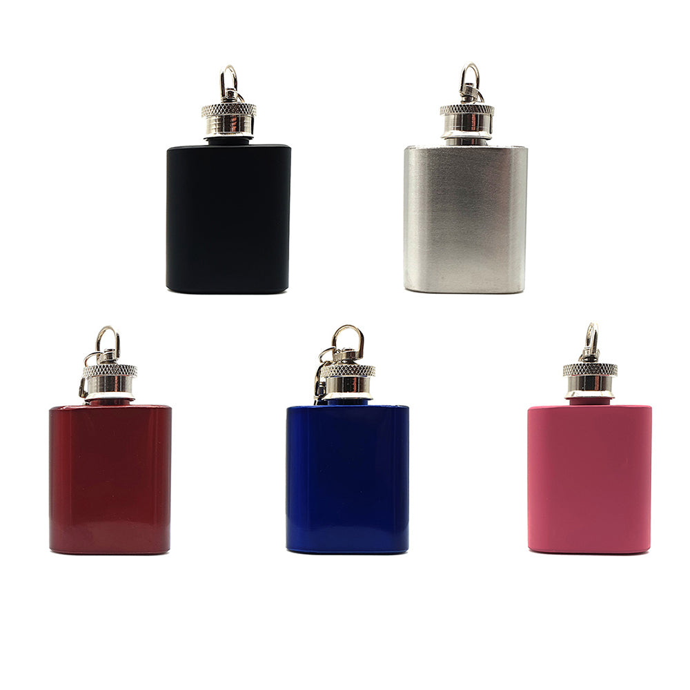 Set of five small flasks in black, silver, red, blue, and pink on a white background