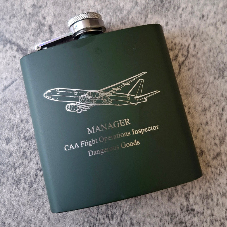 Boeing 777 aircraft artwork engraved on a green hip flask with personalised message below