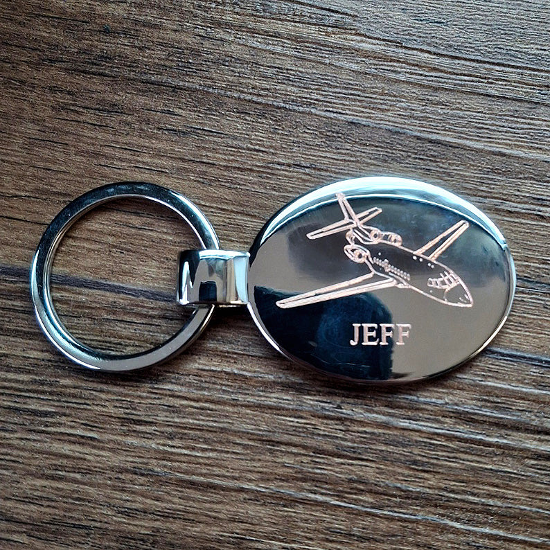 Personalised oval keyring with Falcon 900 design engraved