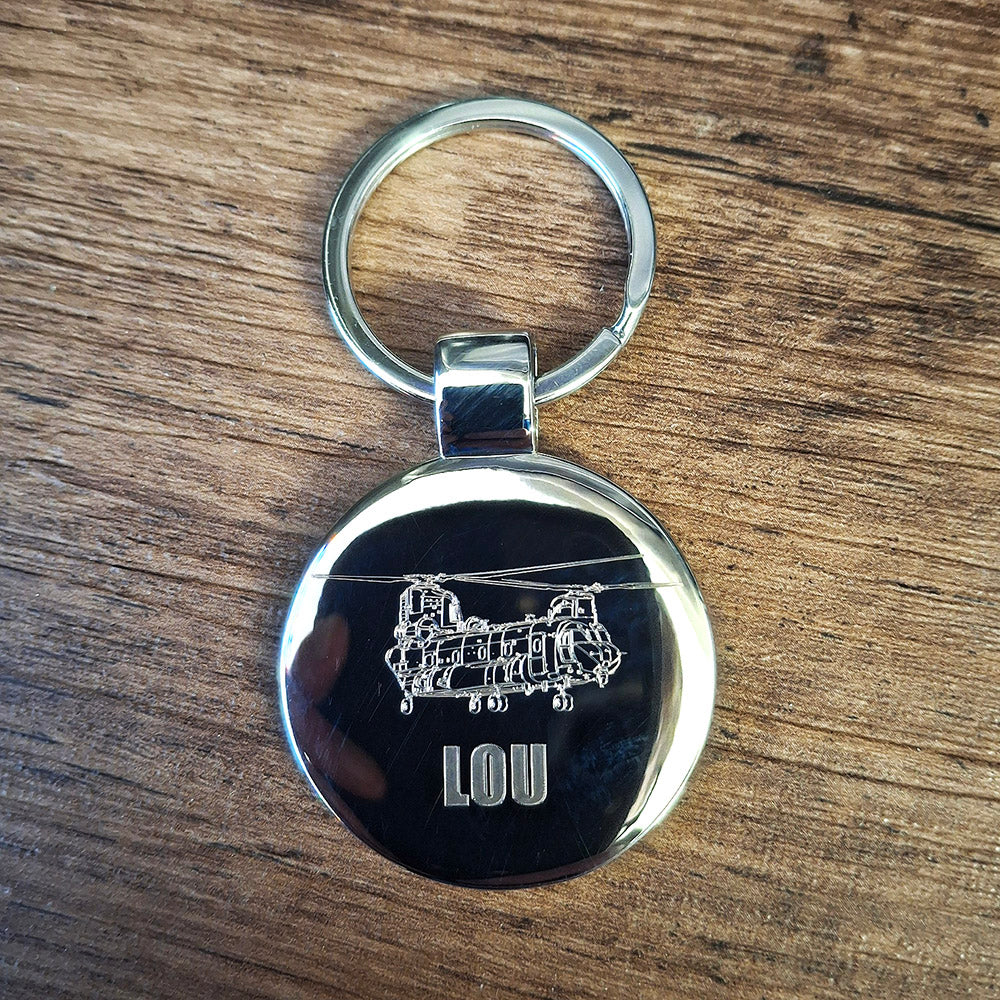 Round Keychain featuring a chinook helicopter engraved design and 'LOU' text.