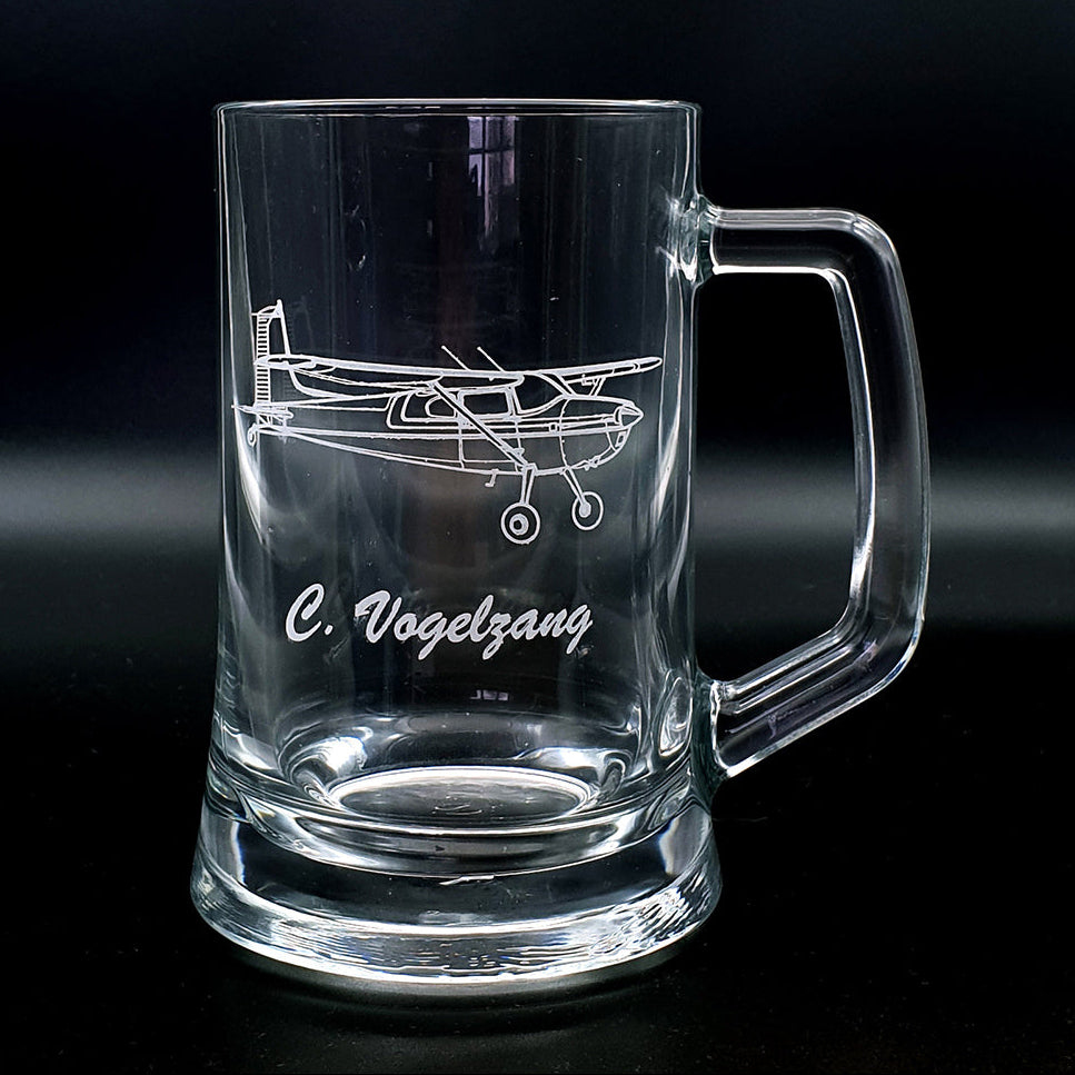 Cessna 180 aircraft glass mug with airplane engraving and 'C. Vogelzang' text on a black background