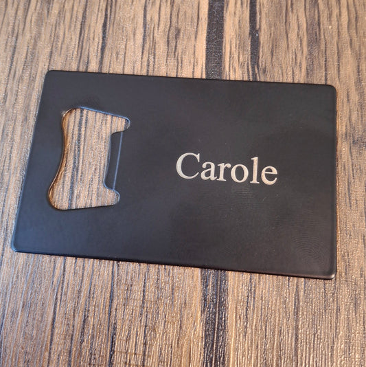 Black Bottle opener engraved with the name 'carole'