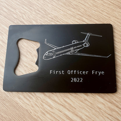 Bombardier CRJ 900 aircraft engraved on black bottle opener with personalised name.