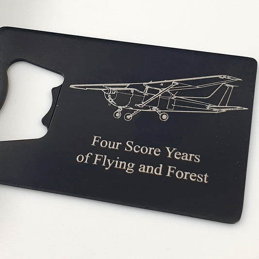 Cessna 172 aircraft engraved on black bottle opener with two lines of personalised text.