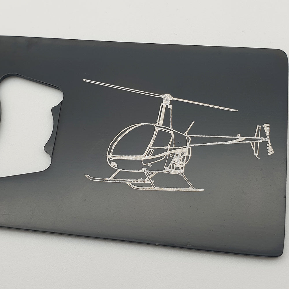 Robinson R22 helicopter artwork engraved on black bottle opener on white background