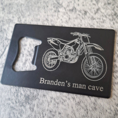Motocross dirt bike design on Black Bottle opener with Brandan's man cave engraved beneath