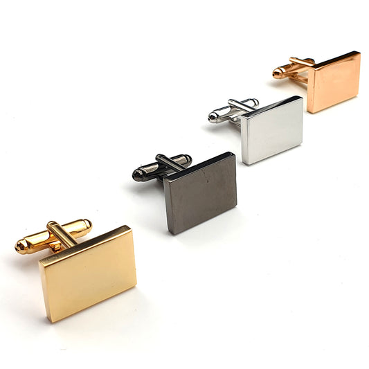 Set of four square cufflinks in gold, silver, and rose gold on a white background