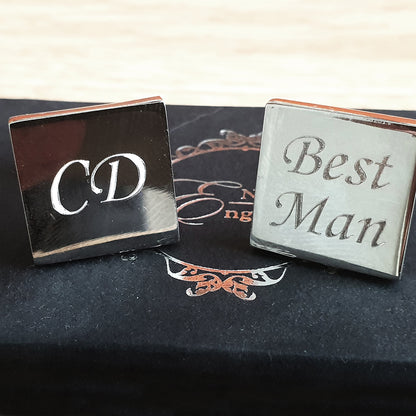 Pair silver Cufflinks with 'CD' and 'Best Man' text on a black background