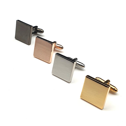 Set of four square cufflinks in different colors on a white background