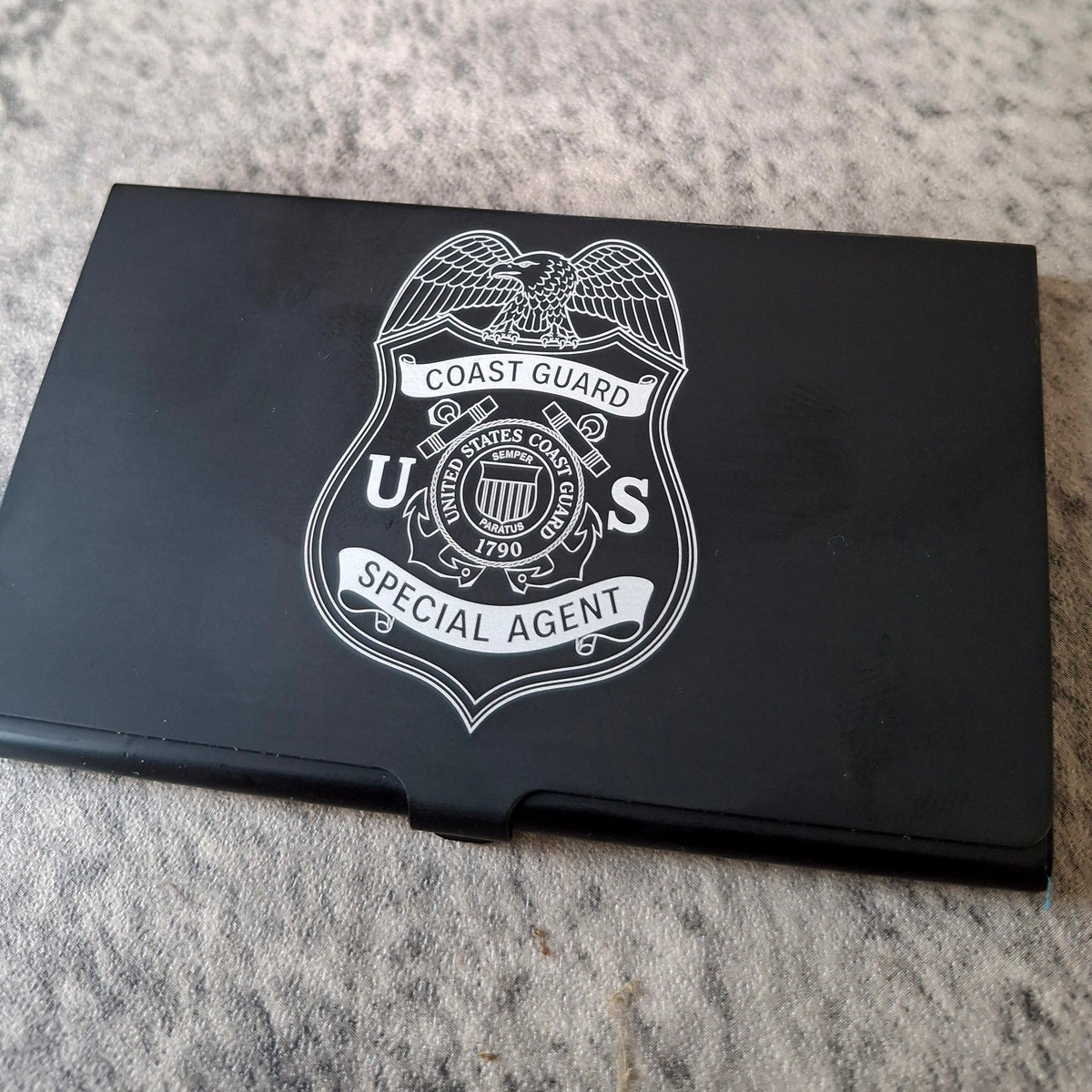 Black Card holder with Coast Guard Special Agent logo engraved on the front