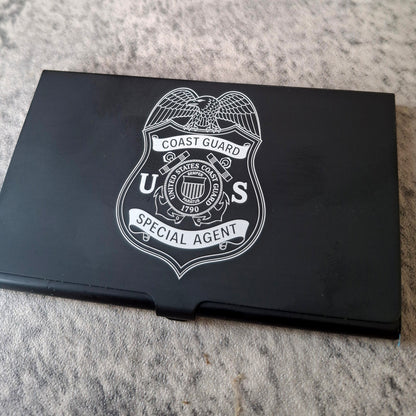 Black Card holder with Coast Guard Special Agent logo engraved on the front
