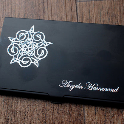 Black card holder with celtic knot in the top left and named engraved in Edwardian script  in bottom right
