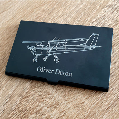 Cessna 152 aircraft design engraved on black card holder with Oliver Dixon engraved underneath.