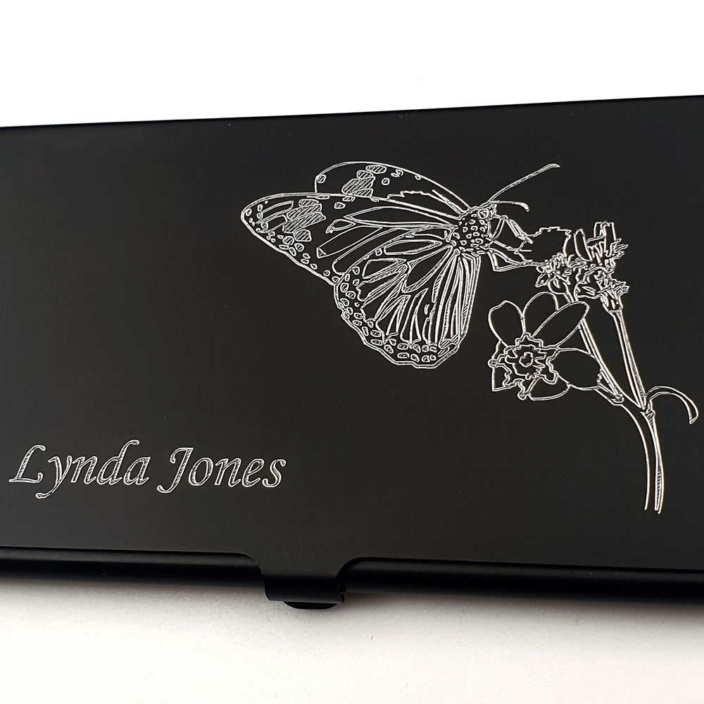 Black Card Holder with Butterfly and plant design on a white background