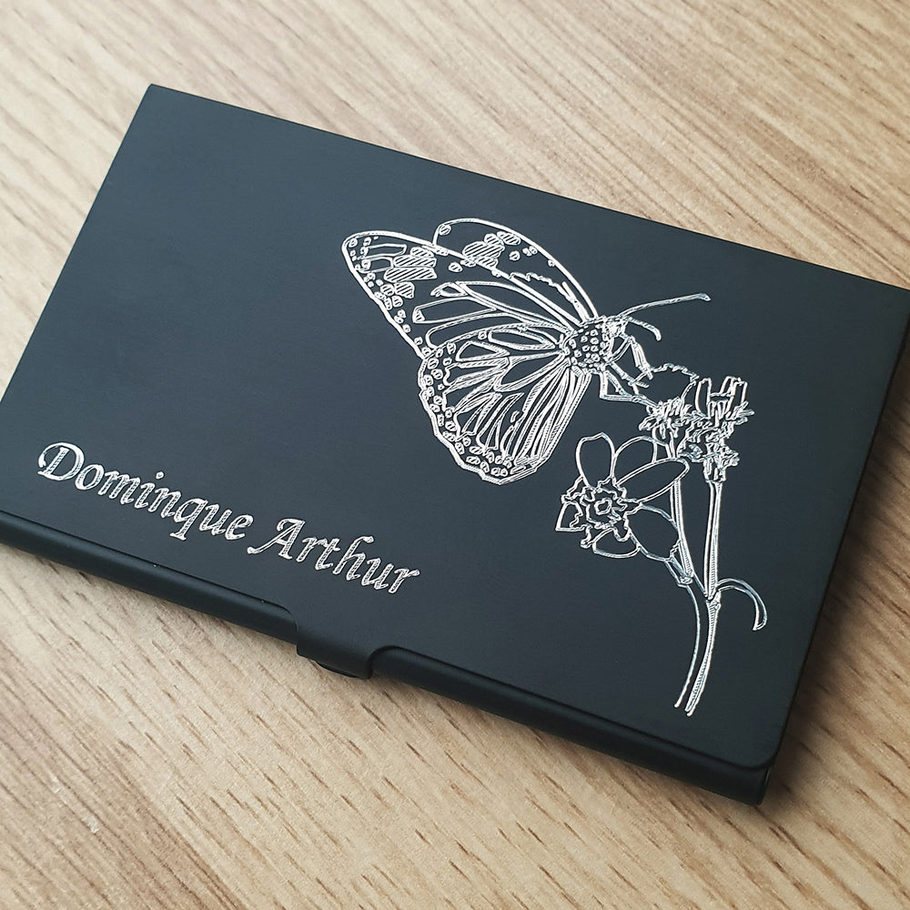 Black Card Holder with Butterfly and plant engraving with name in opposite corner.
