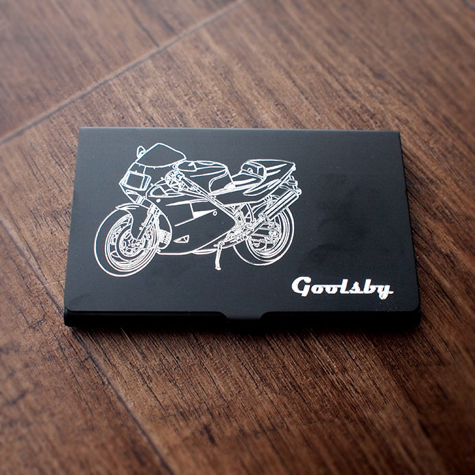 Duc 888 Motorcycle artwork engraved on Black business card case shown on a wood background