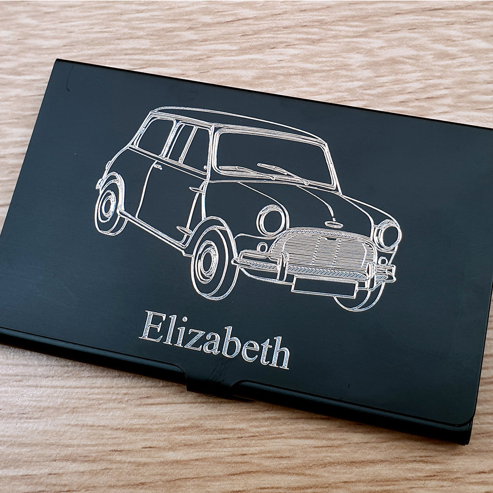 Classic mini car design engraved on black card case with name added beneath.