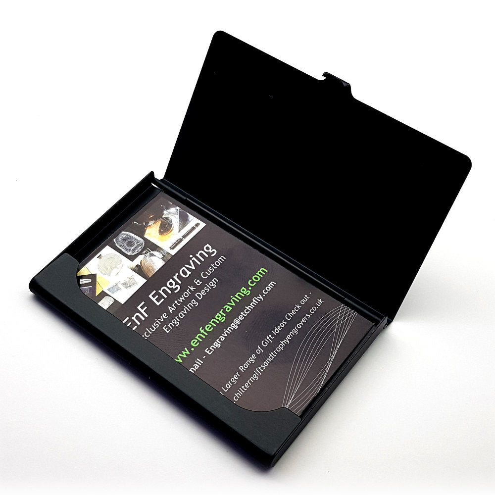 black business credit card holder open showing business cards in place against white background