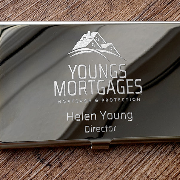 Metallic business card with 'Youngs Mortgages' logo and text on a wooden surface background