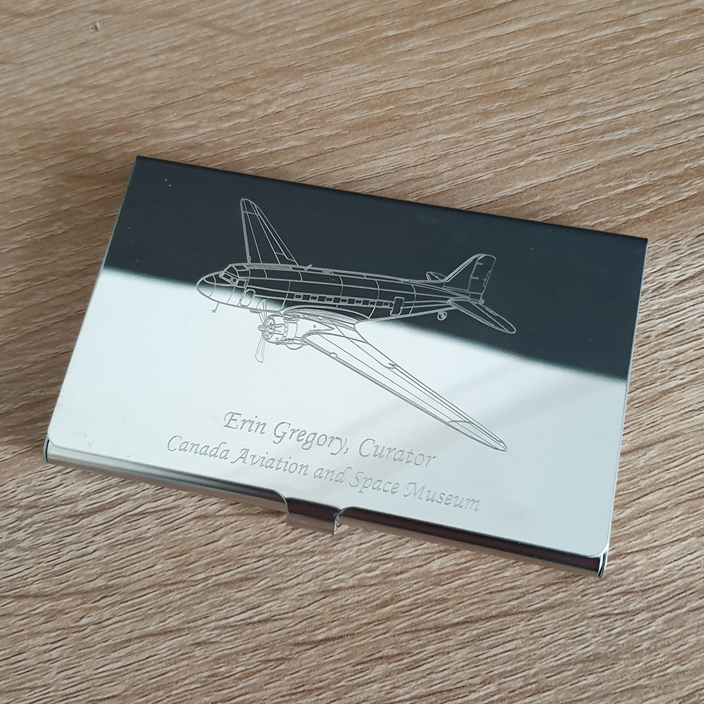 Vintage Douglas DC3 aircraft engraved on a steel card holder case with name beneath.