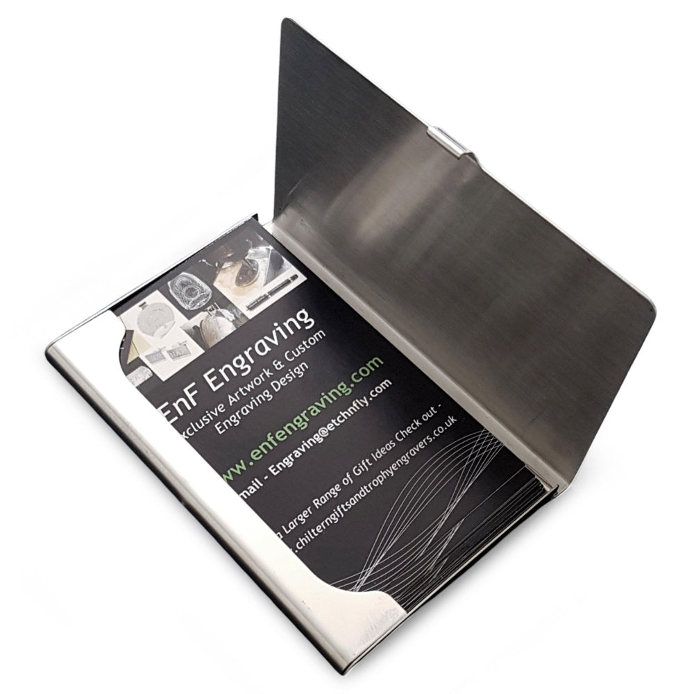 steel business credit card holder open showing business cards in place against white background