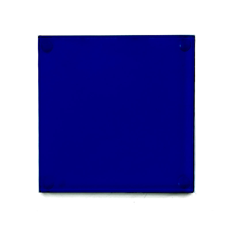 sapphire blue glass drinks coaster with rubber studs in the back shown from above on a white background