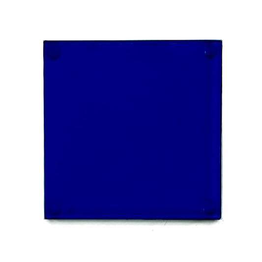 sapphire blue glass drinks coaster with rubber studs in the back shown from above on a white background