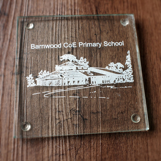 Square glass drinks coaster glass  with 'Barnwood CoE Primary School' engraving on a wooden background