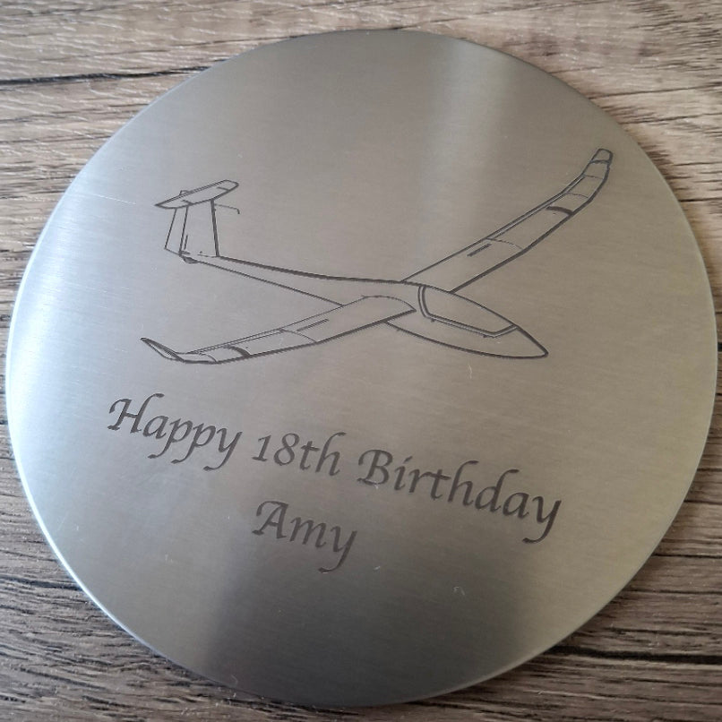 Discus glider with birthday message engraved on round steel drinsk coaster