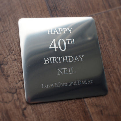 Premium steel drinks coaster with 'Happy 40th Birthday Neil' engraved on a wooden surface background