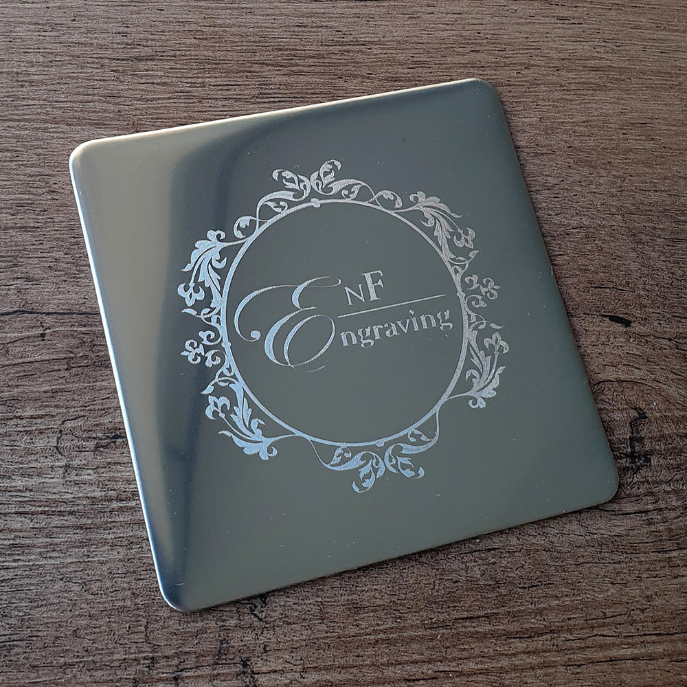 metal square coaster  with 'EnF Engraving' logo on a wooden surface background