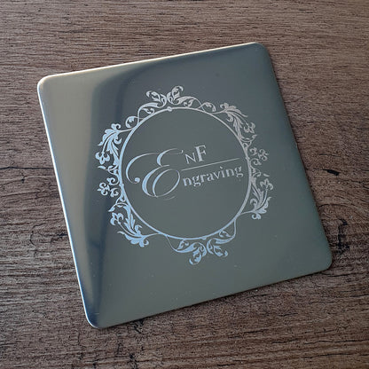 metal square coaster  with 'EnF Engraving' logo on a wooden surface background