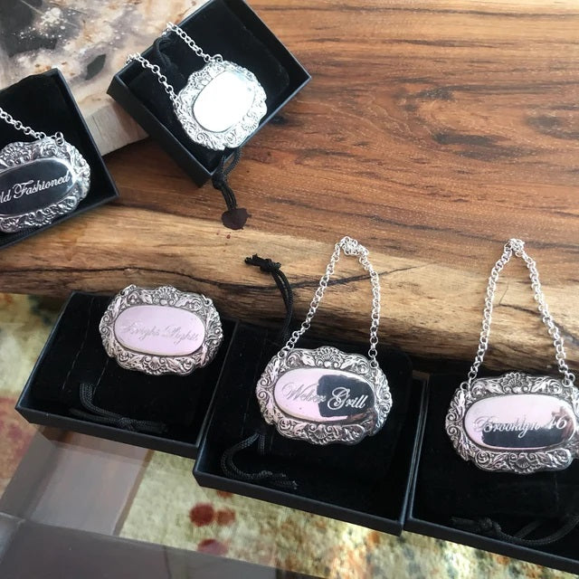 Selection of five bottle labels engraved