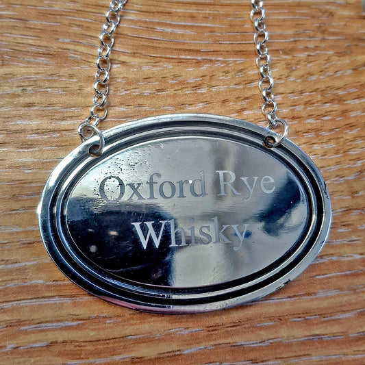 handmade Pewter bottle tag engraved with 'Oxford Rye Whisky'