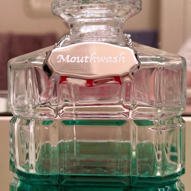 Mouthwash decanter label over a glass decanter