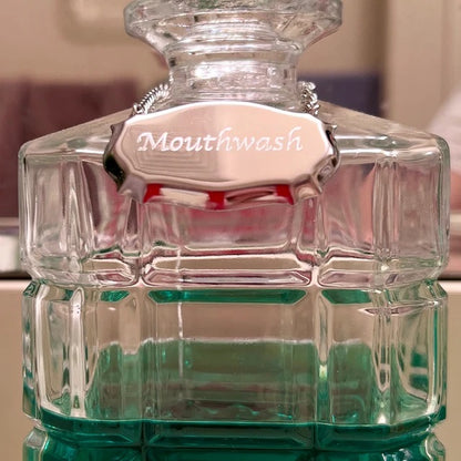 Mouthwash decanter label over a glass decanter