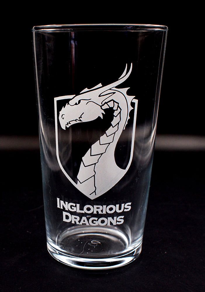 Conical beer glass with 'Inglorious Dragons' logo on a black background