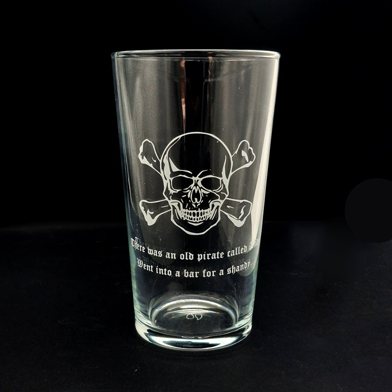 Skull Crossbones artwork with text engarved ona beer glass