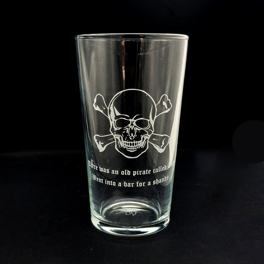 Skull Crossbones artwork with text engarved ona beer glass