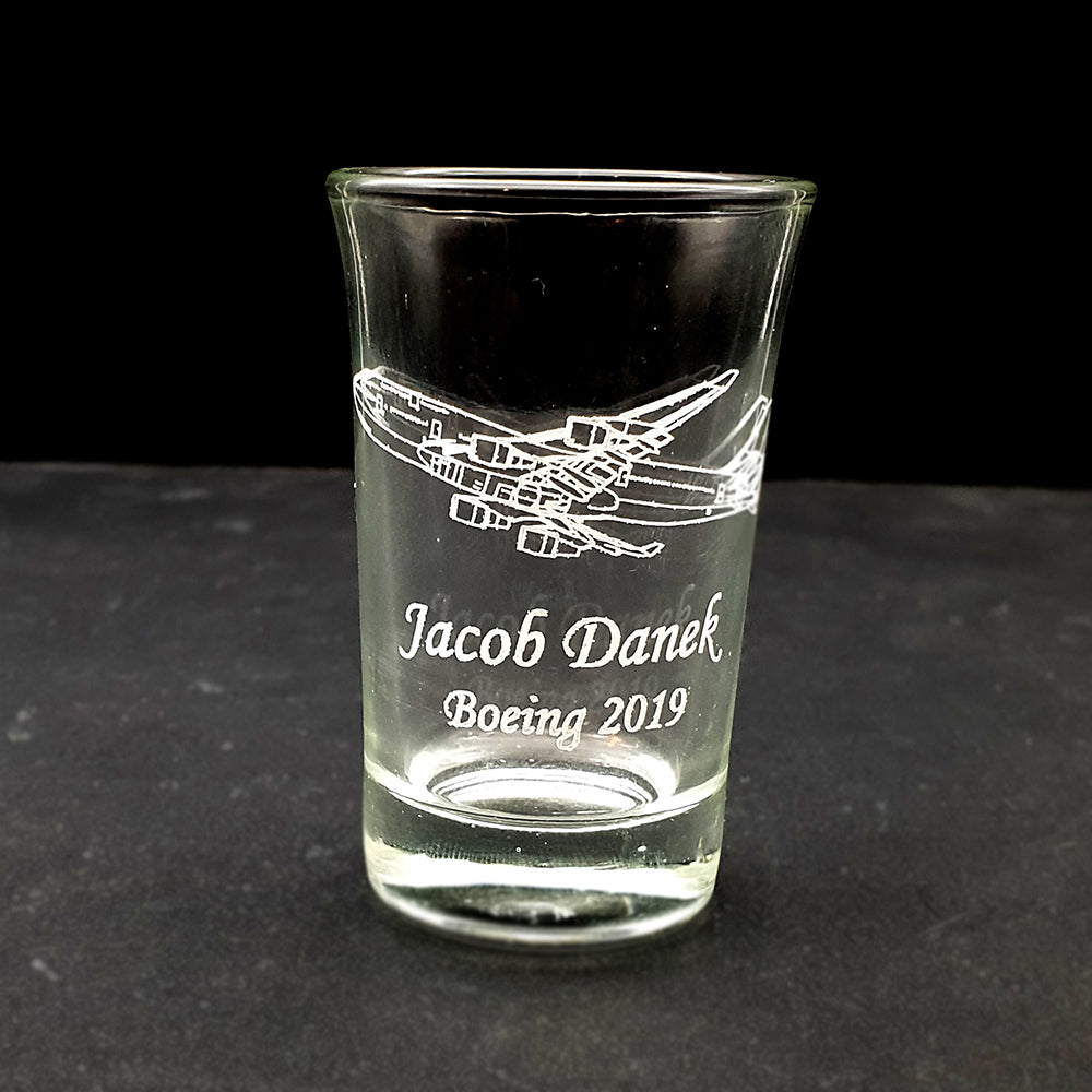 Essence shot glass engraved with text and Boeing 747 artwork