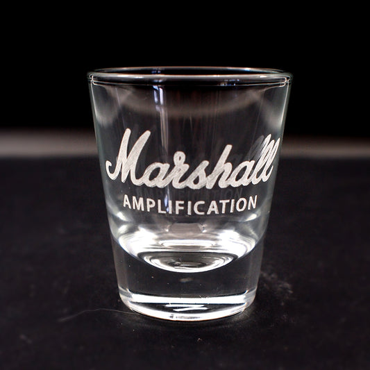 Clear glass with 'Marshall Amplification' engraving on a black background