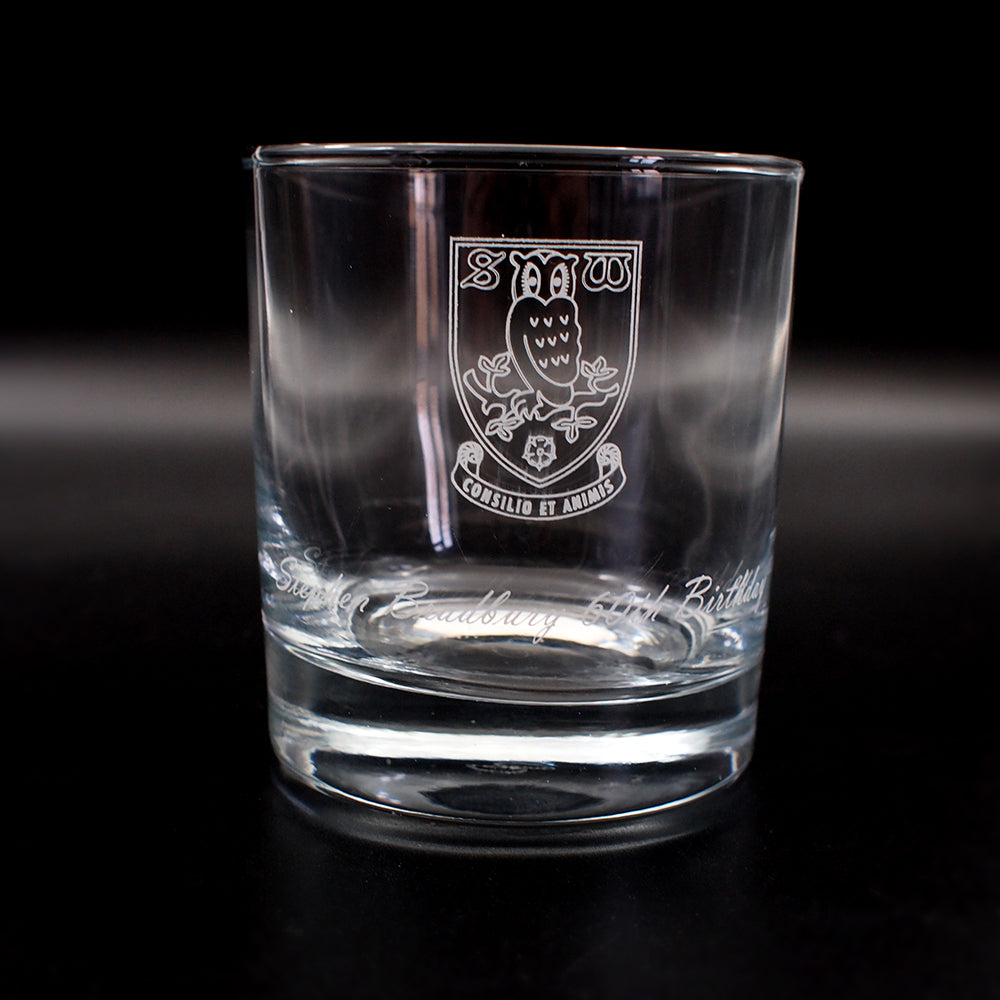everyday tumbler glass with logo and text engraved on the front