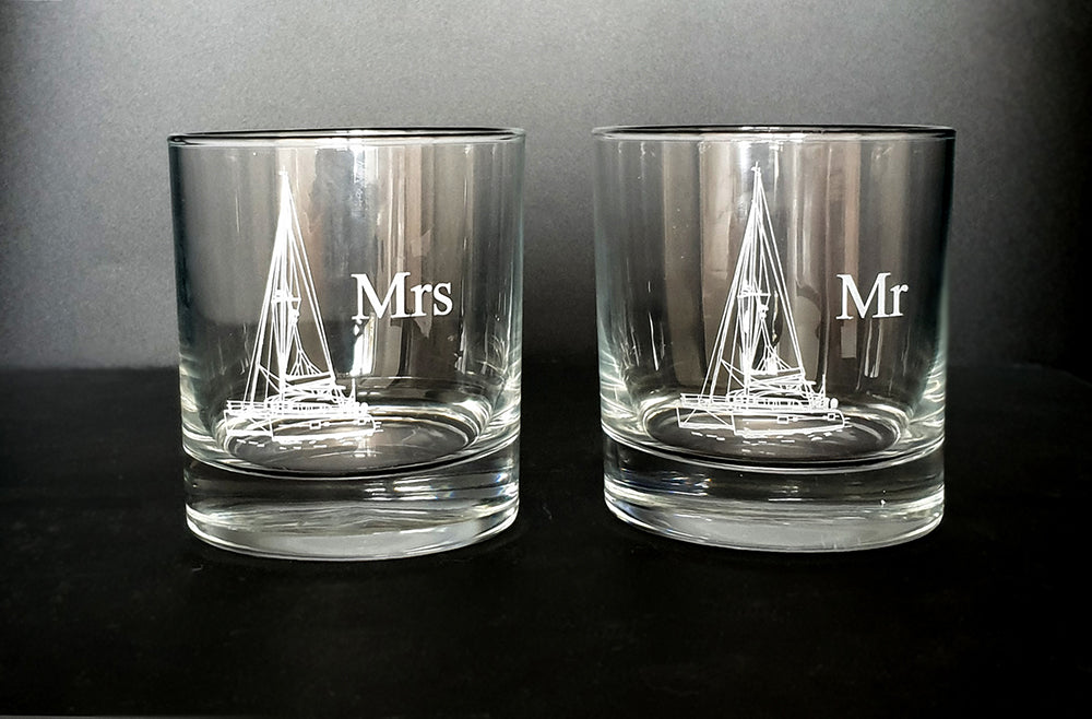 Mr and Mrs Pair of Glass tumblers each with a catamaran artwork engraved.