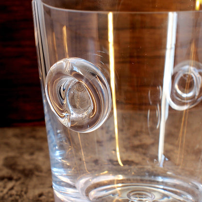 Close up of handles on bubble base glass ice bucket 