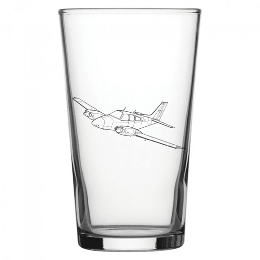 mockup image of Pint Beer Glass engraved with Beechcraft Baron Aircraft Artwork | Giftware Engraved