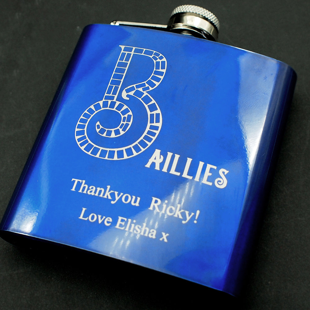 Blue flask with 'Baillies' branding and personalized text on a dark background