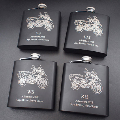 Set of four personalised Black hip flask with KLR 650 Motorcycles artworks and personalised messages engraved on each.