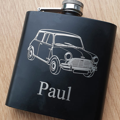 Black flask with a classic mini car illustration and 'Paul' text on a wooden surface